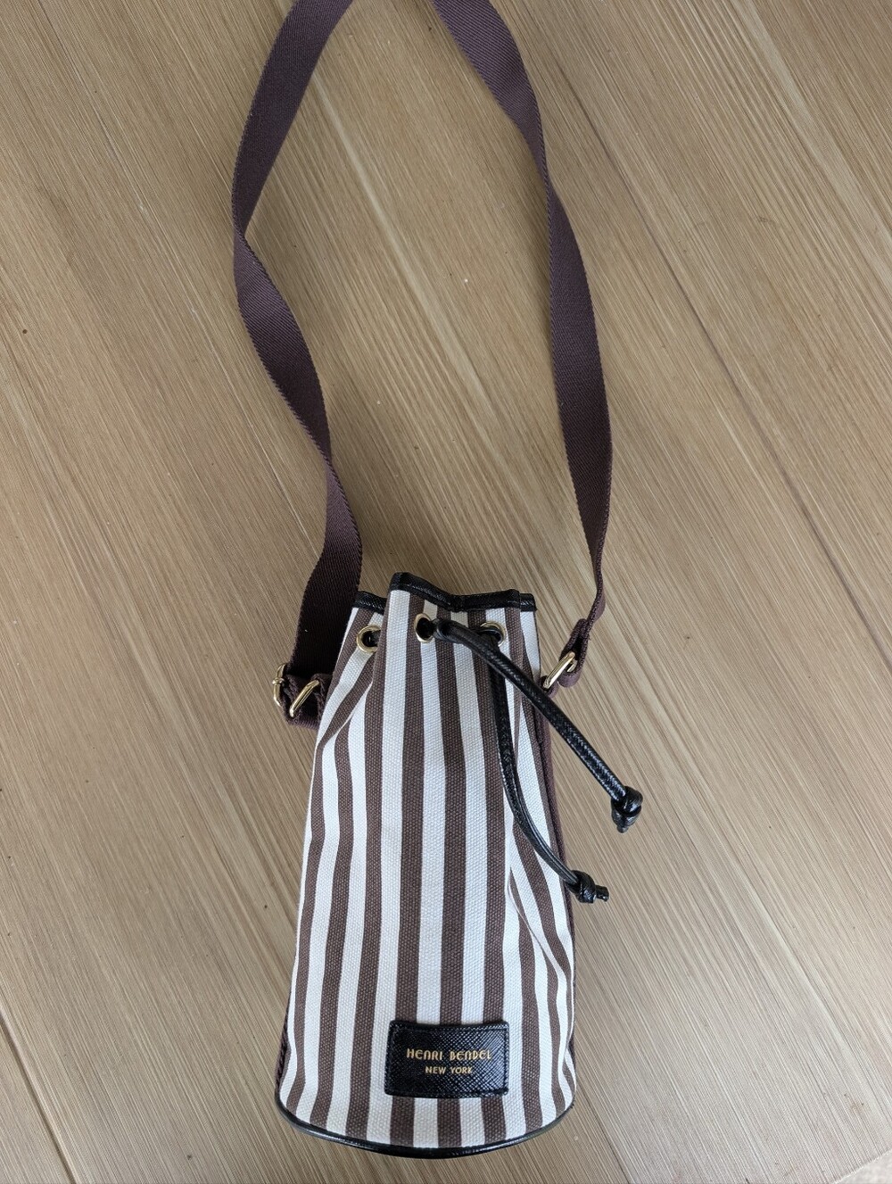Henri Bendel Brown and White Striped Canvas Drawstring Bottle Bag